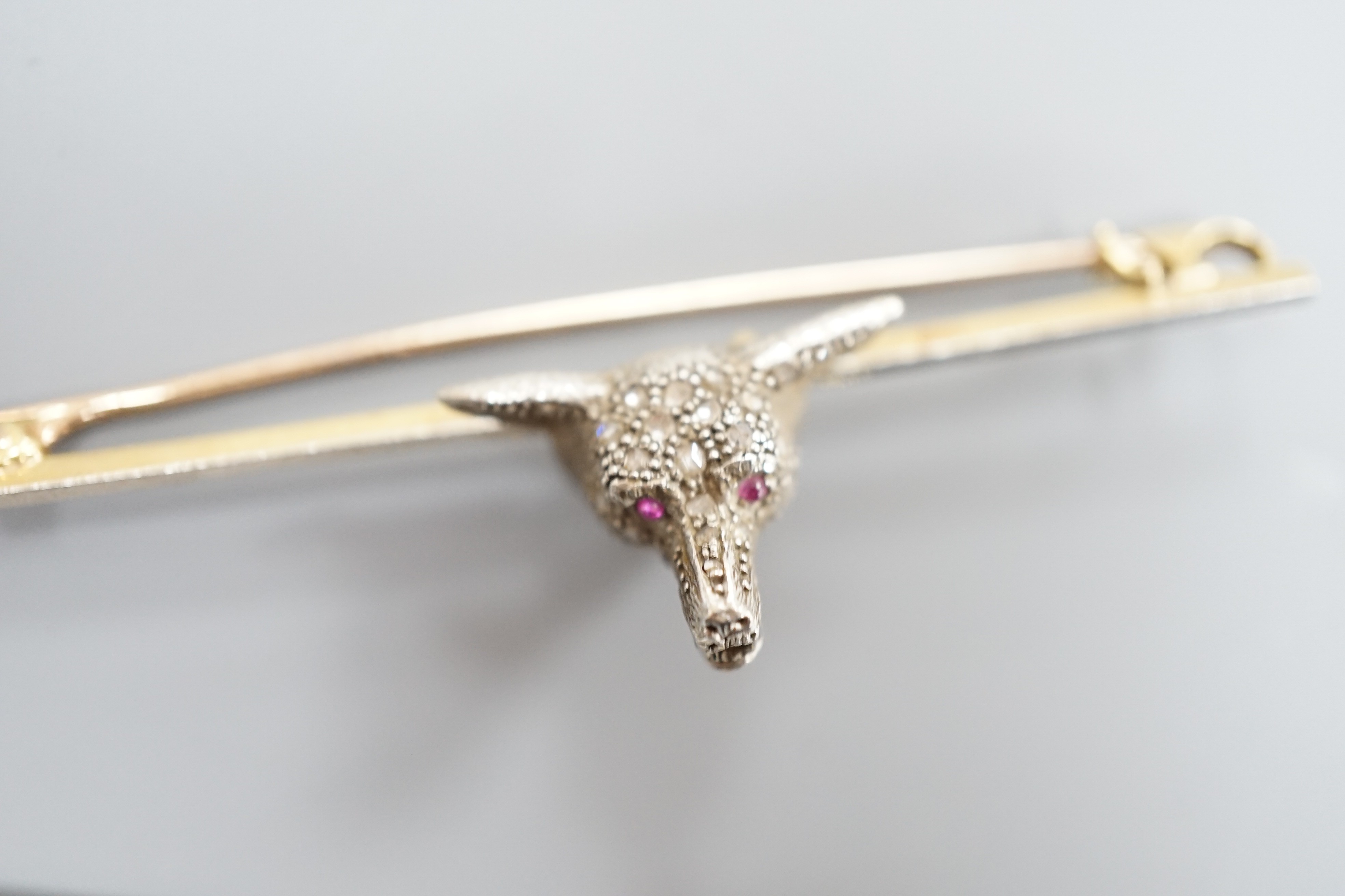 A yellow and white metal, rose cut diamond set fox head bar brooch, 62mm and a yellow metal, rose cut diamond and turquoise set bar brooch, gross weight 11.6 grams.